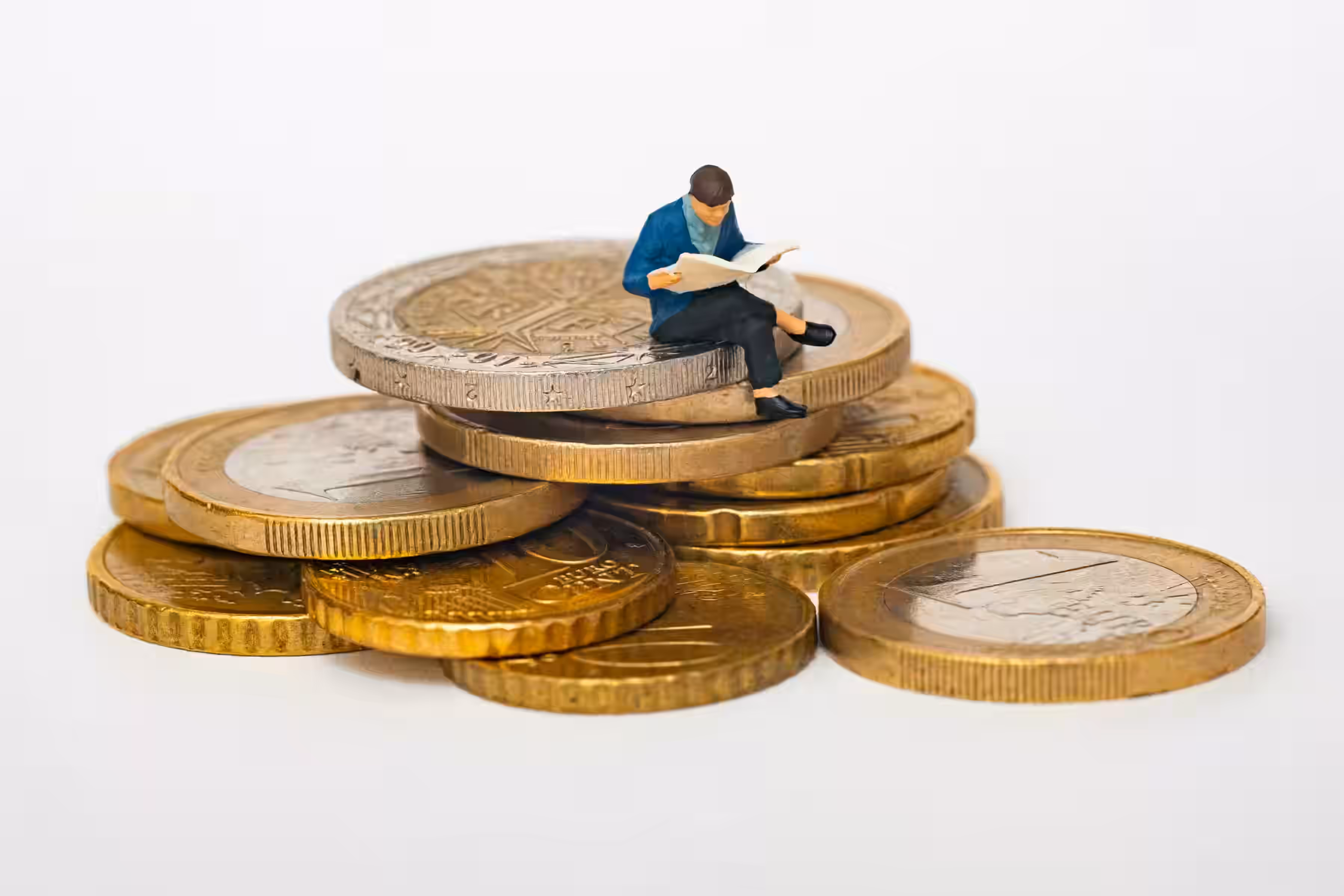 Person relaxing while sitting on pile of money